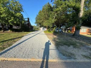 a driveway that was graded and leveled with bobcat machines by One Stop Dumpsters and Demo in Charlotte North Carolina