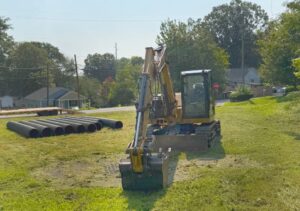 a large machine tearing down a buiilding in charlotte north carolina operated by one stop dumpsters and demo