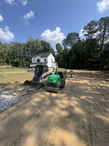 a driveway that was graded and leveled with bobcat machines by One Stop Dumpsters and Demo in Charlotte North Carolina